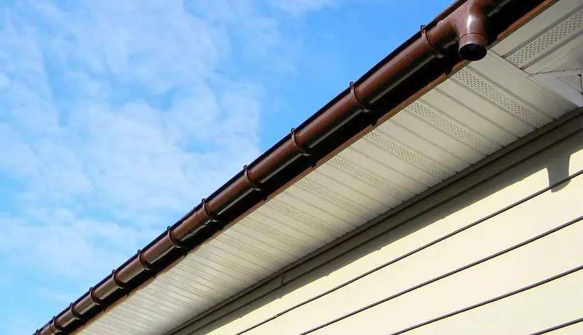 White soffit meeting a dark brown gutter system — JR Seamless Gutters, Nashville, TN