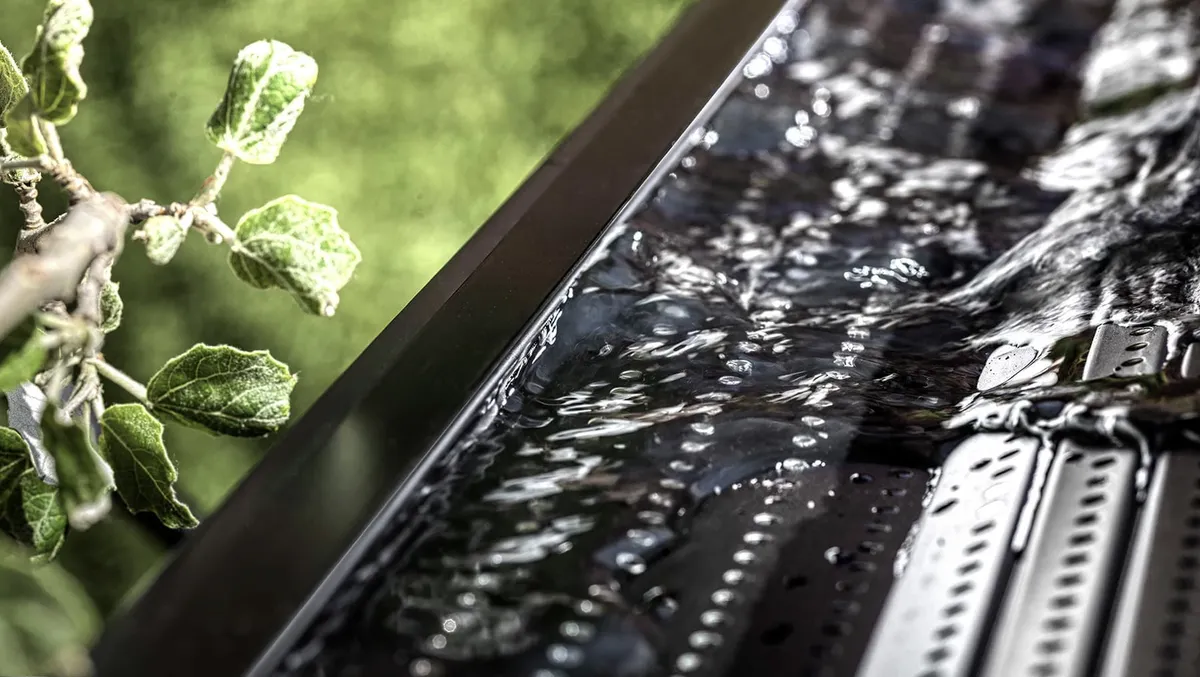 Gutter guard surface shedding rainwater — JR Seamless Gutters, Nashville, TN