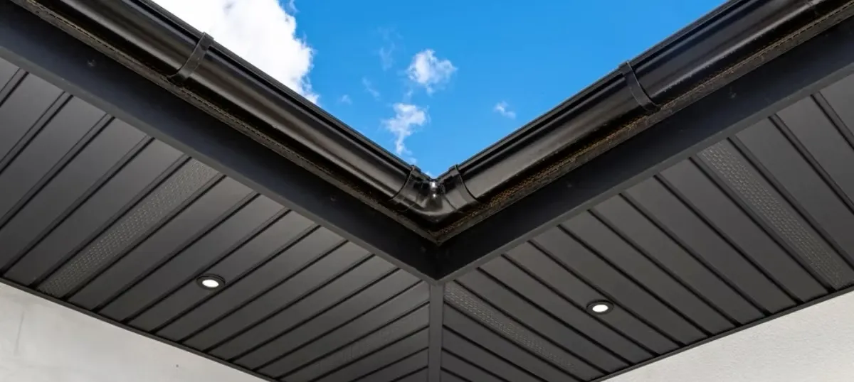 Dark fascia, soffit and gutters against a blue sky — JR Seamless Gutters, Nashville, TN