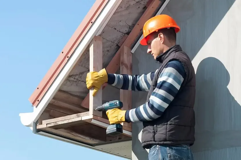 Worker fitting fascia trim wrap