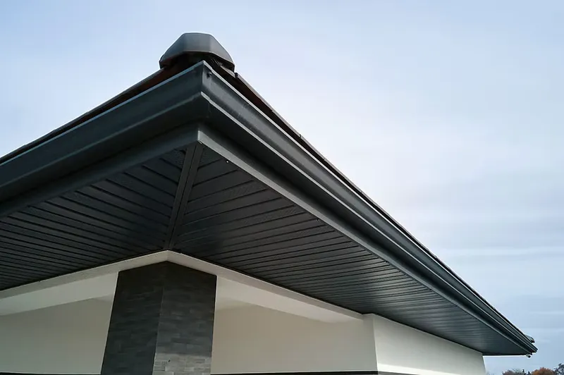 Finished corner with vented soffit and matching gutters